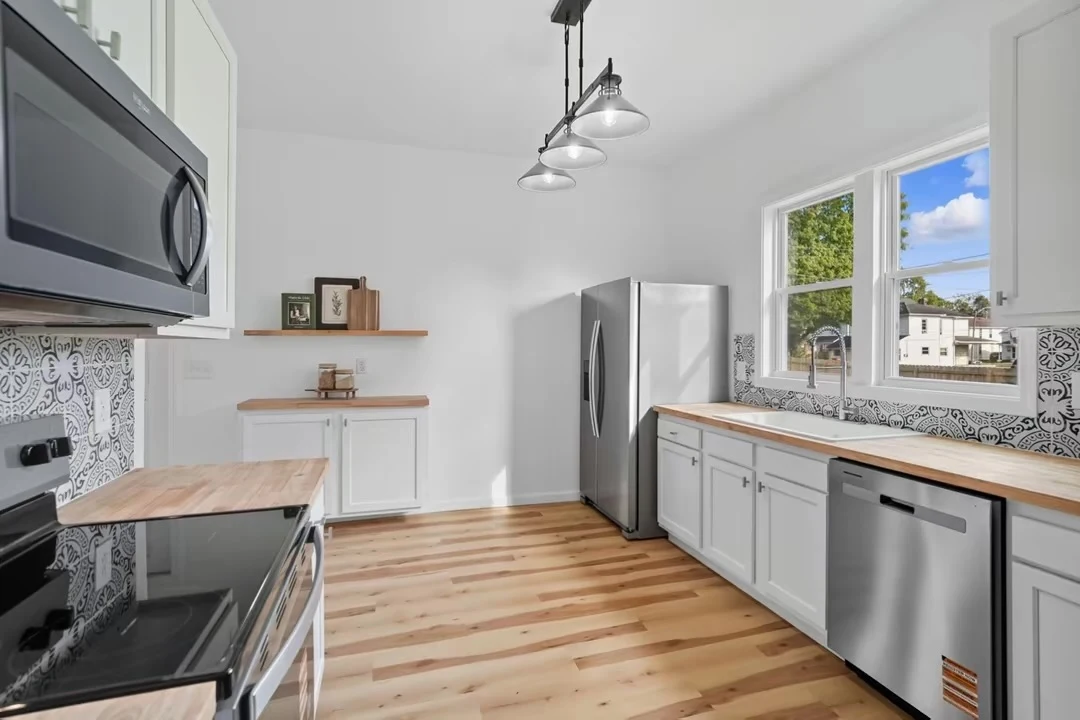Cabinetry, sink and stainless steel appliances