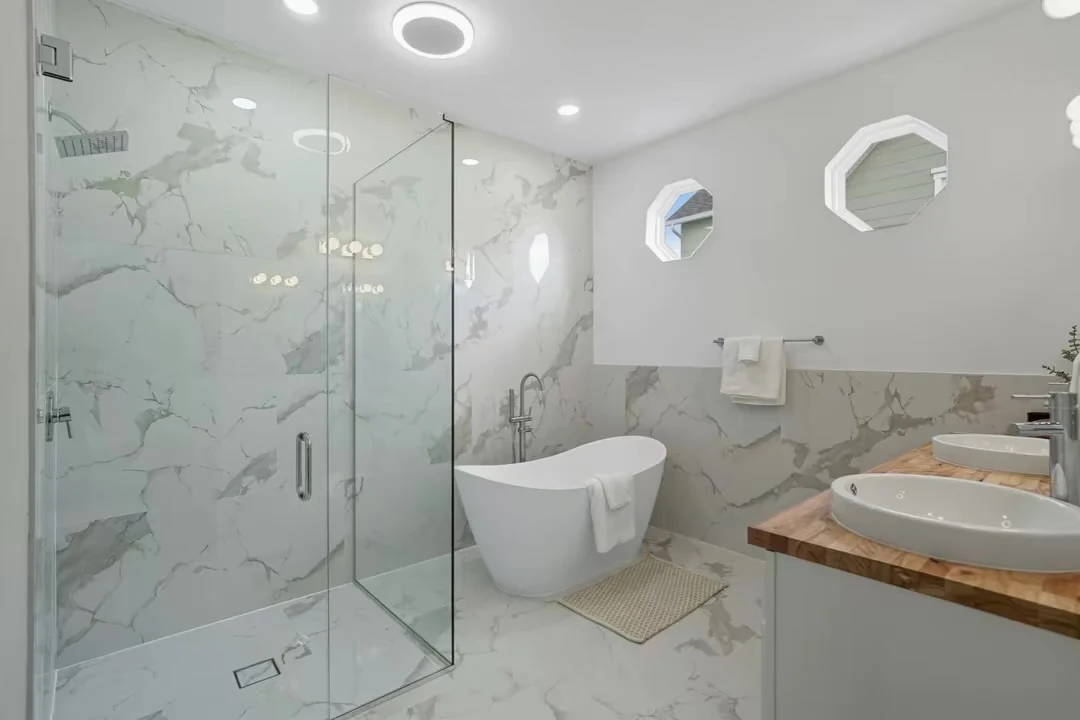 Glass shower, freestanding tub and double vanity