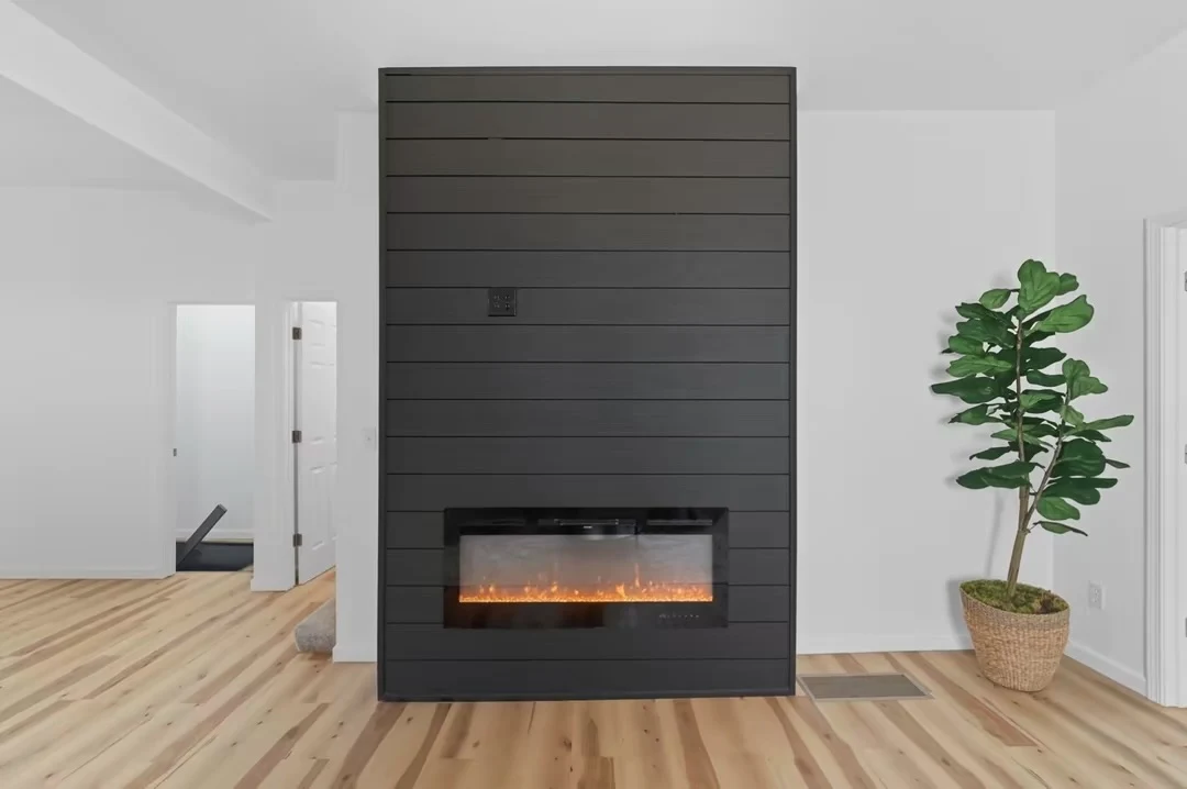 Dark horizontal accent wall with electric fireplace